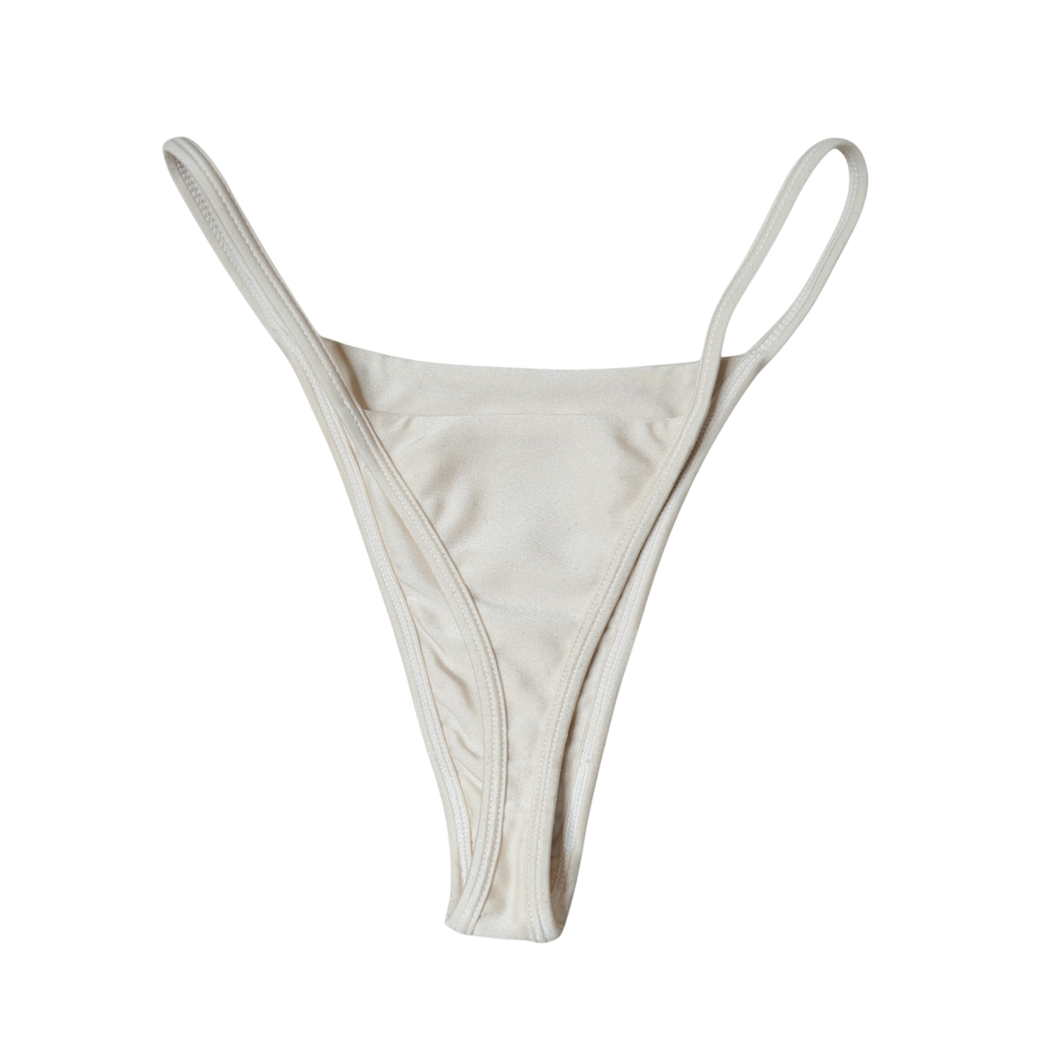 Cream Aláti Ola high-cut thong bikini bottom, back flat-lay, with thong rear