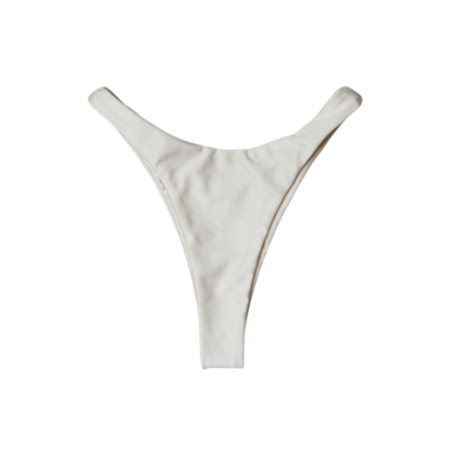 Cream Aláti Delfini high-cut thong bikini bottom, back flat-lay, with thong rear